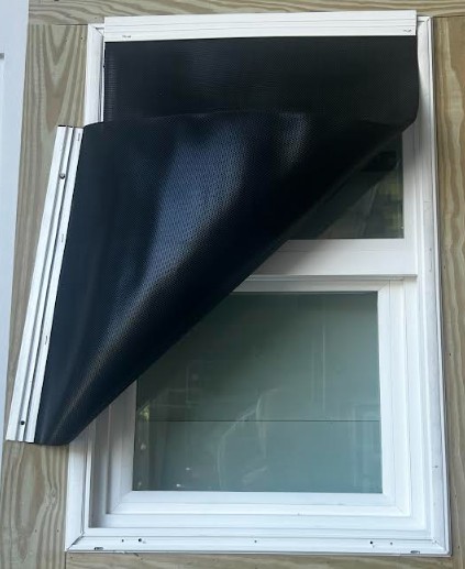 Storm Jamb window with black Storm Trim fabric installed