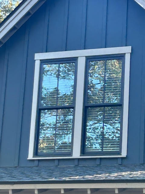 Second-story windows with Storm Trim bases seamlessly installed