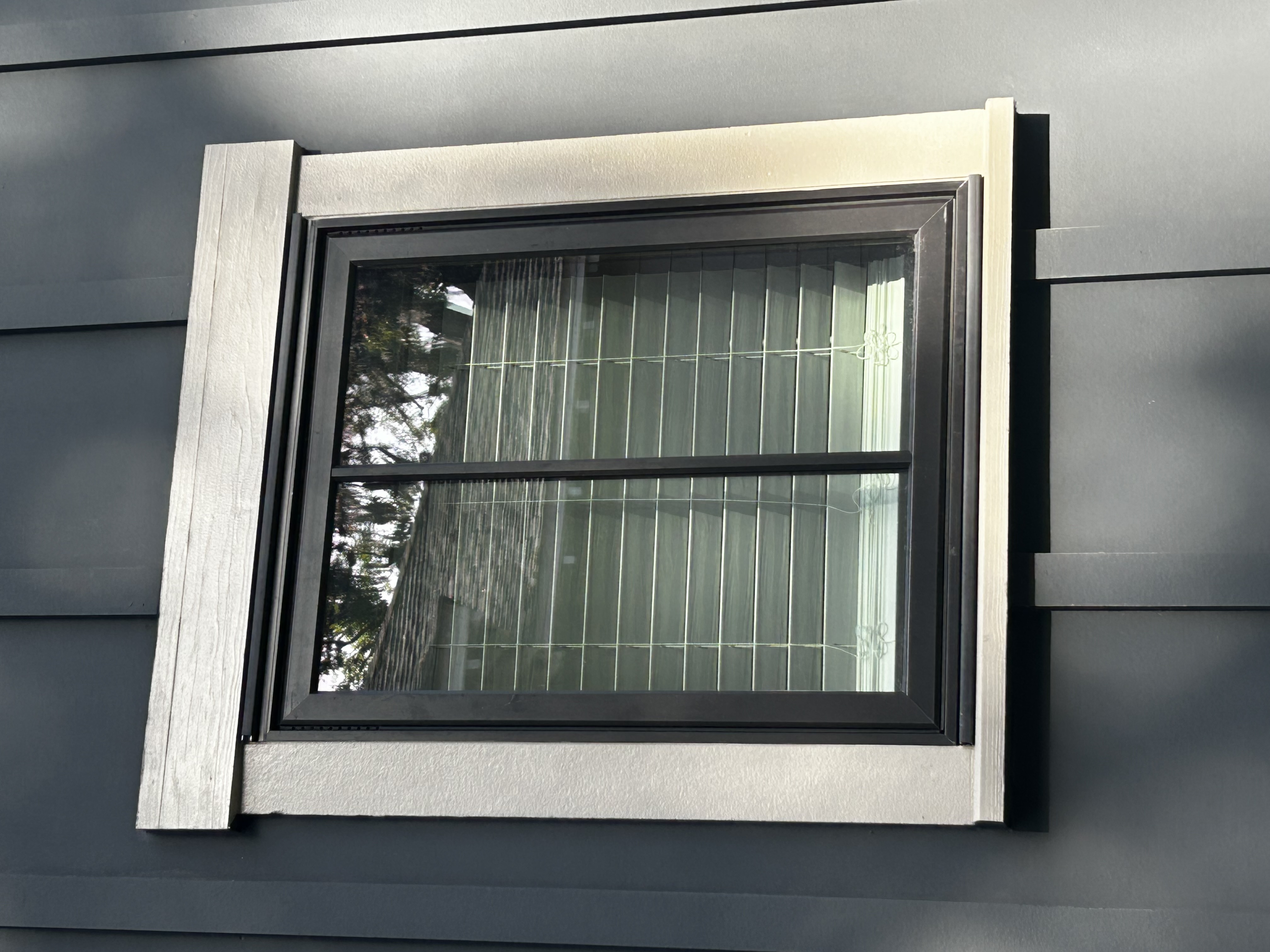 Single window with black Storm Trim base blending with trim