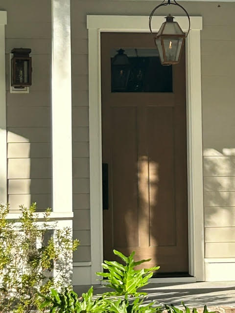 Storm Trim base mounted on sides of exterior door, blending with trim